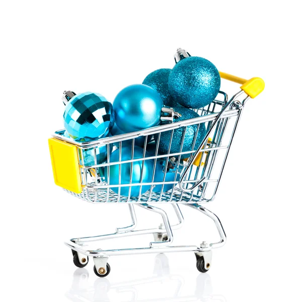 Shopping cart full of christmas balls isolated — Stock Photo, Image
