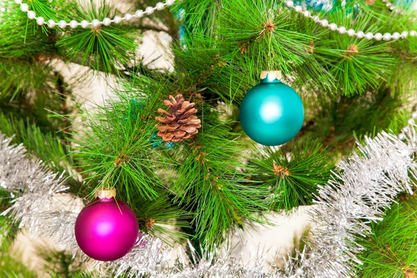 Christmas decorations hanging on christmas tree — Stock Photo, Image