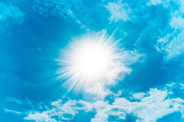 Blue sky with clouds and sun — Stock Photo, Image