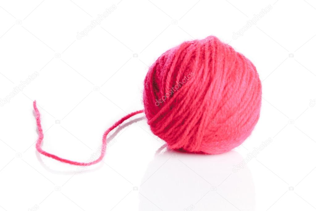 Red wool yarn ball isolated on white background 