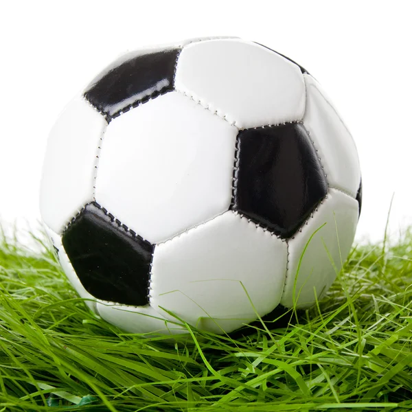 Soccer ball on green field — Stock Photo, Image