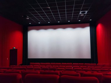 Cinema Screen  And Red Seats. Empty Screening Theater