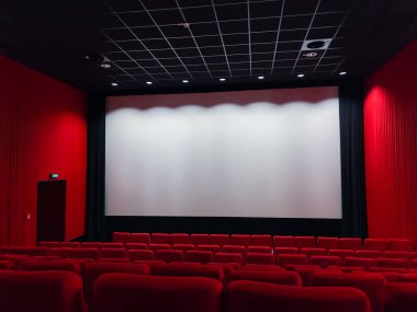 Cinema Screen  And Red Seats. Empty Screening Theater