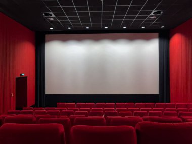 Cinema Screen  And Red Seats. Empty Screening Theater