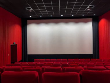 Cinema Screen  And Red Seats. Empty Screening Theater
