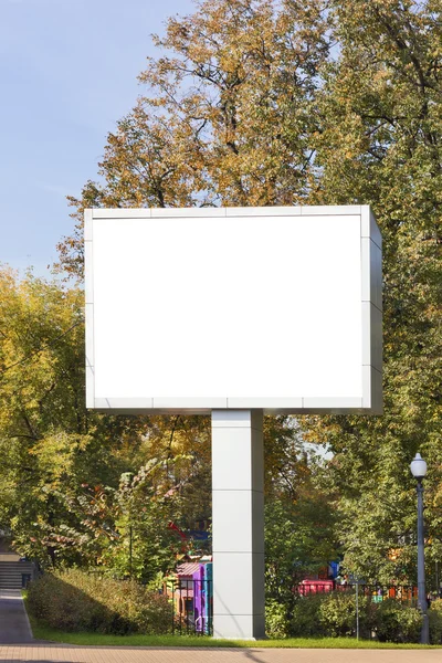 Emty big LED display in autumn city park — Stock Photo, Image