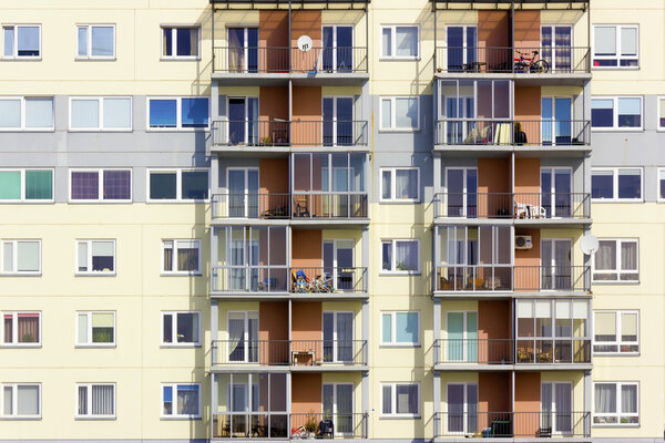 Windows and balconies of a multiroom apartment house of mass building