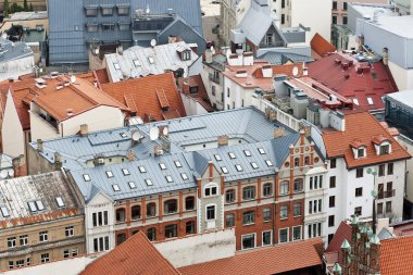 Red and blue city roofs