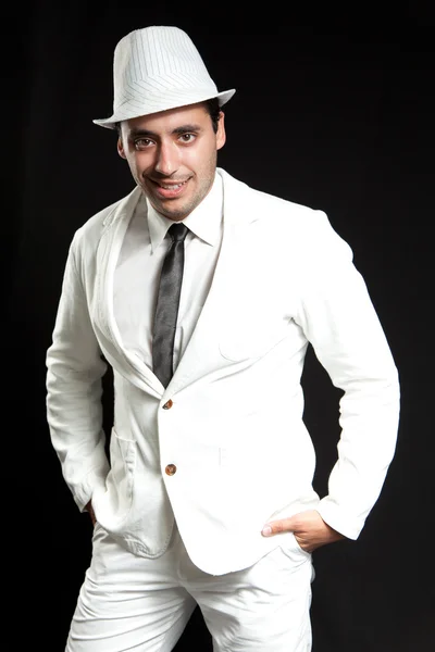 Hat joy sexual young man. Wearing white suit and black tie. Port — Stock Photo, Image