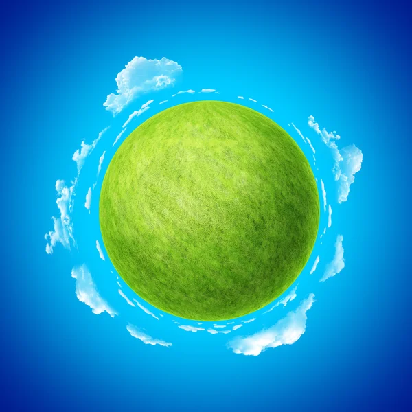 Green planet with blue skies and clouds template concept. — Stock Photo, Image