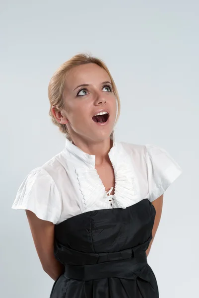 Surprised sexy blonde! Lady against grey background wearing fash — Stock Photo, Image