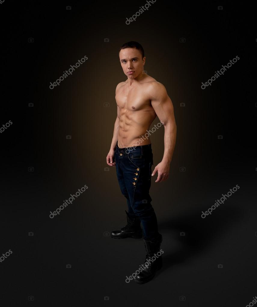 Sexy naked torso fit and neat young man studio full portrait Stock Photo by  ©sellingpixsellingpix 31419827