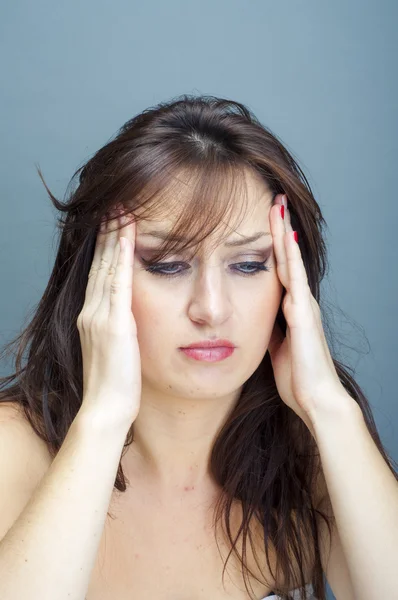 Girl with headache Stock Picture