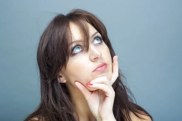 Young brunette woman thinking — Stock Photo, Image