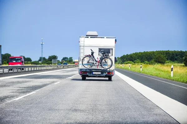 Camper on road — Stock Photo, Image