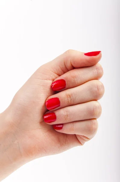Mão feminina com unhas pintadas de vermelho — Fotografia de Stock