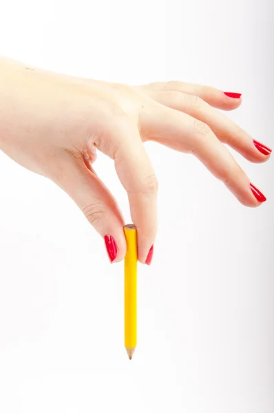 Ženská ruka s červeně malované nehty — Stock fotografie