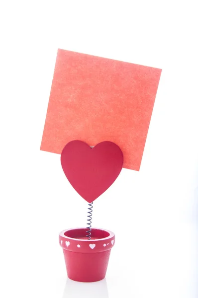 Red holder with heart and paper — Stock Photo, Image