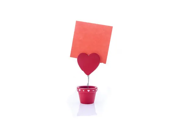 Red holder with heart and paper — Stock Photo, Image