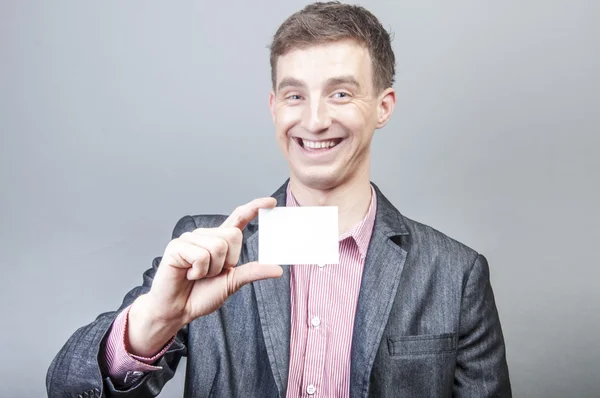 Businessman holding blank card — Stock Photo, Image