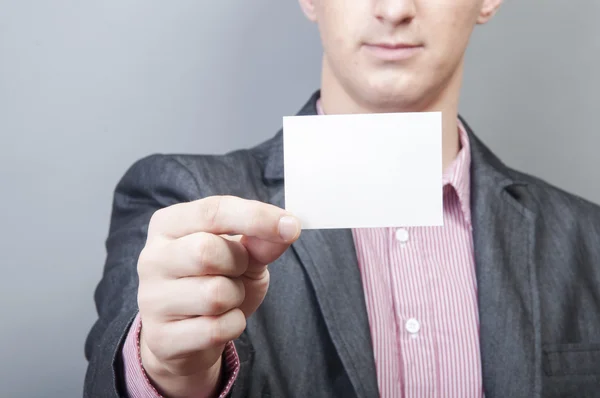 Businessman holding blank card — Stock Photo, Image