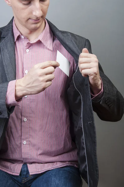 Businessman holding blank card — Stock Photo, Image