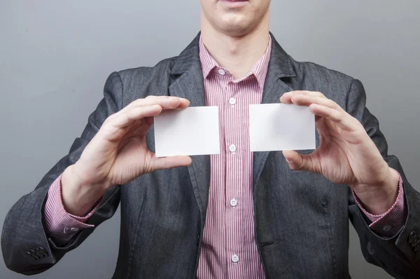 Businessman holding blank card — Stock Photo, Image