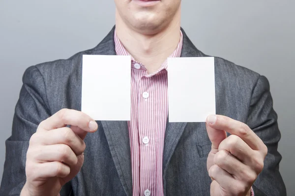 Businessman holding blank card — Stock Photo, Image