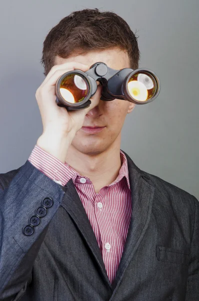 Businessmen looking through binocular — Stock Photo, Image