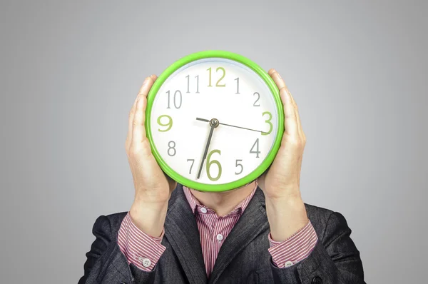 Businessmen holding watch — Stock Photo, Image