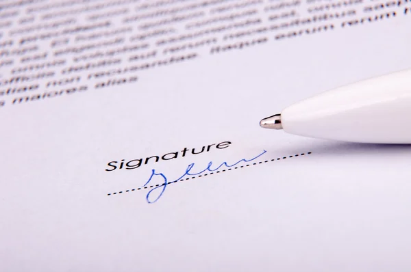 Signature over agreement — Stock Photo, Image