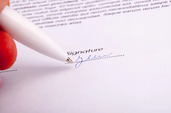 Signature over agreement — Stock Photo, Image