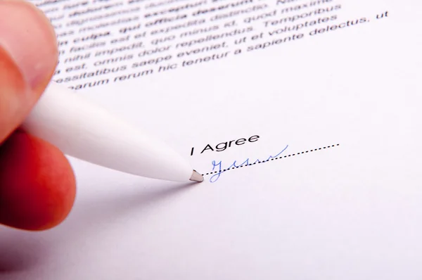 Signature over agreement — Stock Photo, Image