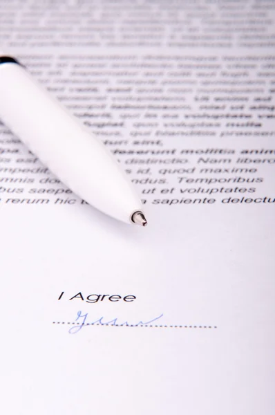 Signature over agreement — Stock Photo, Image