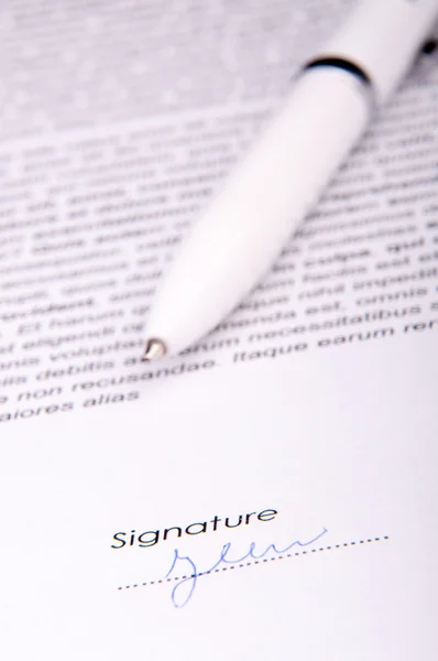 Signature over agreement — Stock Photo, Image