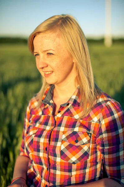 portrait of freckled blonde outside