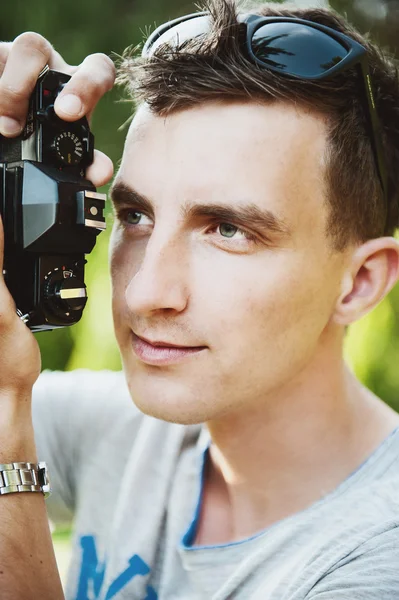 Young photographer takes pictures — Stock Photo, Image