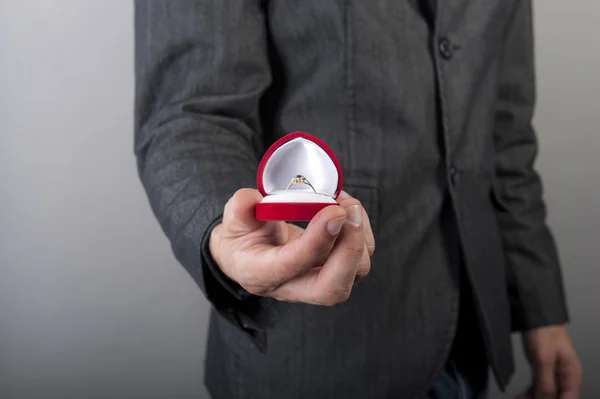 Engagement ring hold by man — Stock Photo, Image