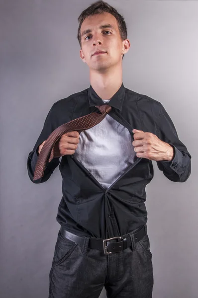 Young businessman pulls shirt — Stock Photo, Image