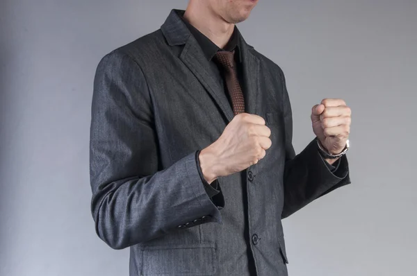 Businessman with clenched fists — Stock Photo, Image