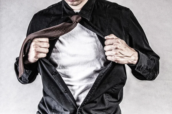 Young businessman pulls shirt — Stock Photo, Image