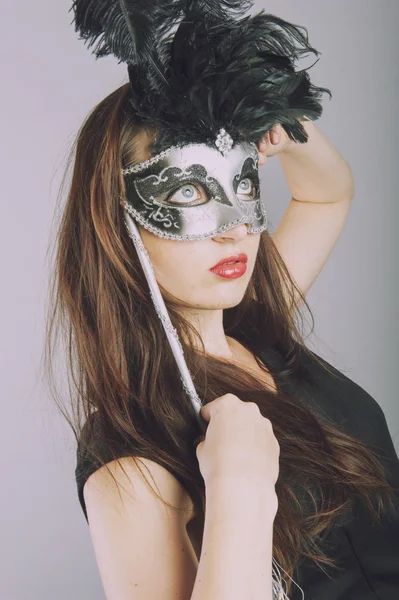 Beautiful young girl with venetian mask — Stock Photo, Image