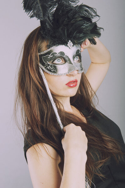beautiful young girl with venetian mask