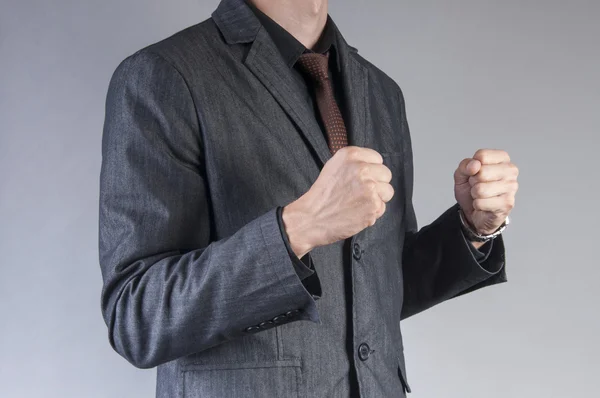 Businessman with clenched fists — Stock Photo, Image