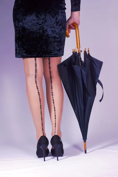 Slim girl with umbrella — Stock Photo, Image