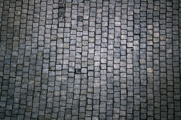 Granite paving stones in the street in Poznan