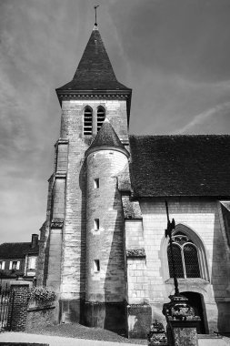 stone medieval church with a bell tower in Champagne, France, monochrome