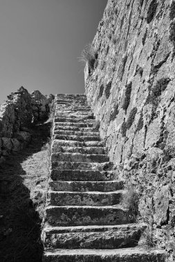 Stone stairs in the medieval Venetian castle of St George's on the island of Kefalonia in Greece, monochrome