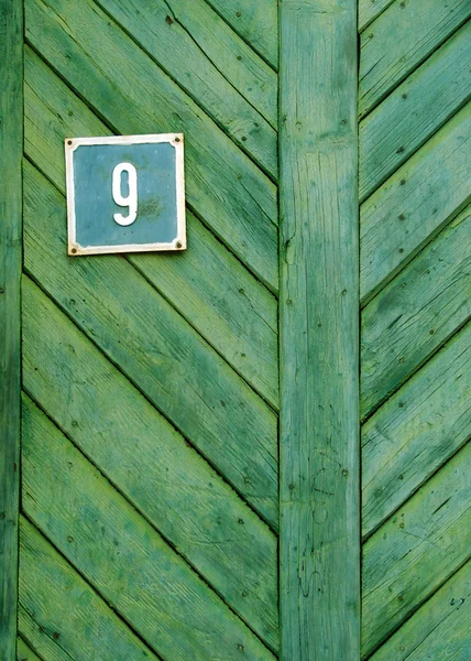 Puerta de madera con número de casa —  Fotos de Stock