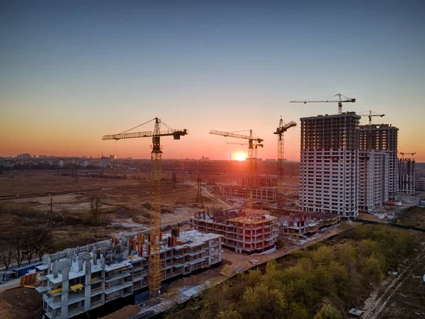 Sunset Construction Site Cranes Building New Houses — стокове фото